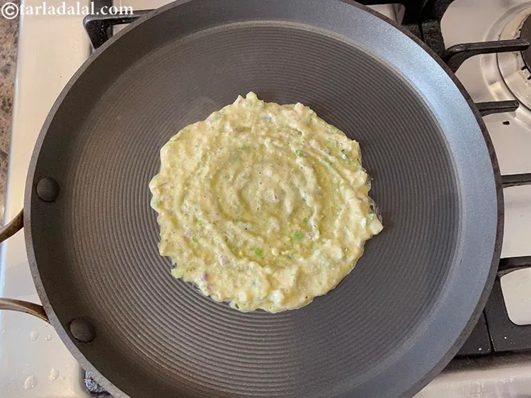 Step 24 – <meta charset="UTF-8" /> Pour a ladleful of the batter on it and spread it in …