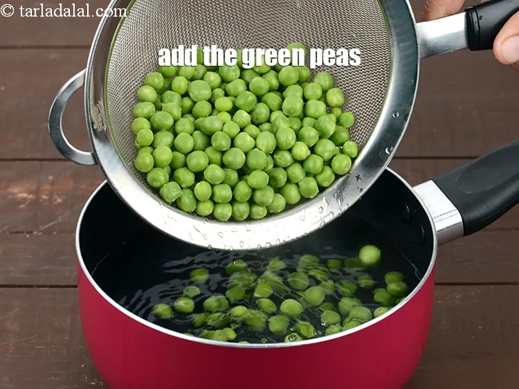 Step 8 – Add the green peas into a saucepan of boiling water.