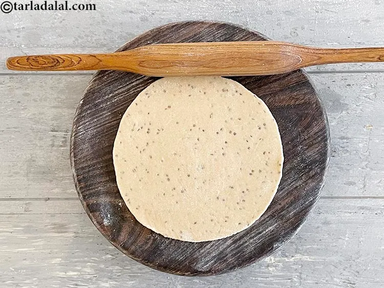 Step 17 – <meta charset="UTF-8" />Roll out each portion into a 175 mm. (7&quot;) diameter circle using a …