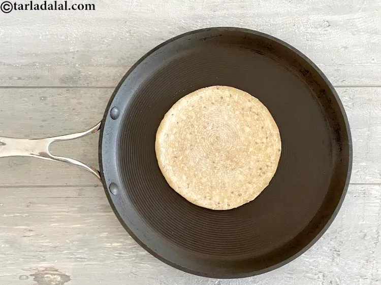 Step 20 – Flip over and cook the other side of the roti for 10 to 15 seconds.