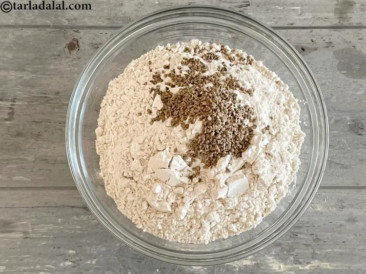 Step 5 – Add 1&nbsp;tablespoon&nbsp;<a href="glossary-carom-seeds-ajwain-thymol-seeds-bishops-weed-266i">carom seeds (ajwain)</a>.