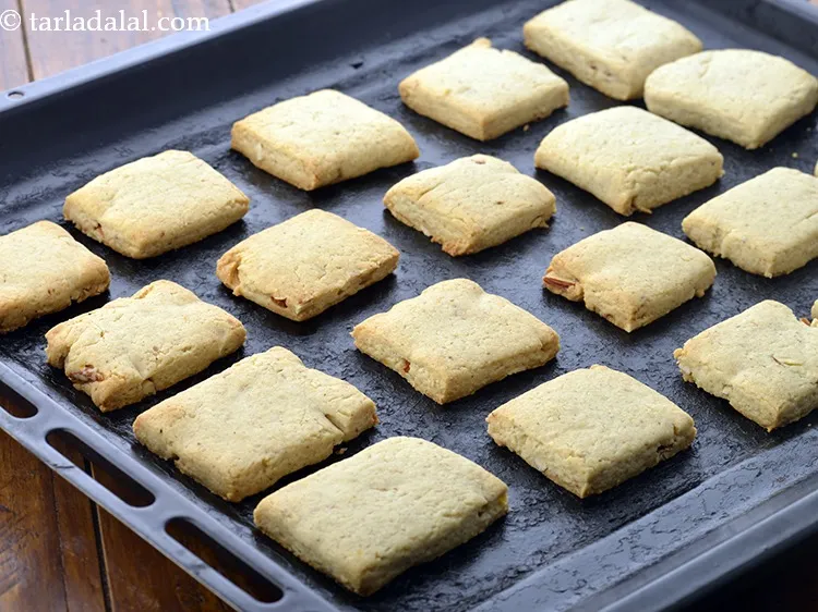 Step 37 – Arrange the square pieces on a baking tray at equal intervals and bake in a …