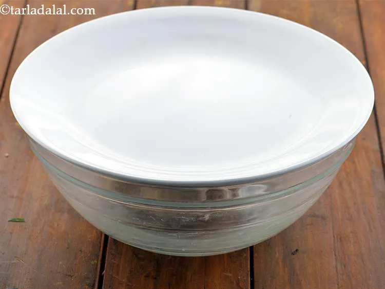 Step 34 – Cover the dough with a lid and keep aside to refrigerate for 15 minutes.