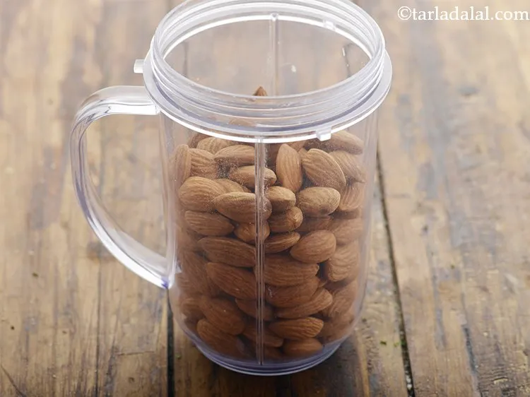 Step 2 – To prepare <strong>homemade almond bread</strong>, put the almonds in a mixer jar.