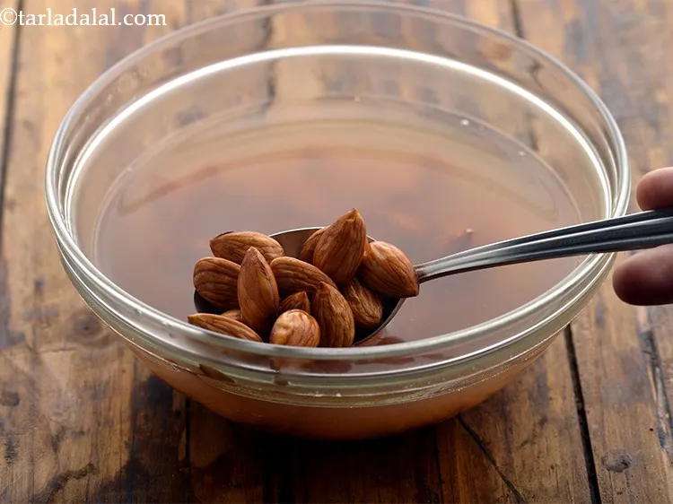 Step 32 – Soak&nbsp;20&nbsp;<a href="https://www.tarladalal.com/glossary-almonds-badam-378i">almonds (badam)</a> in enough hot water for 20 minutes. Soaking is necessary to simplify …