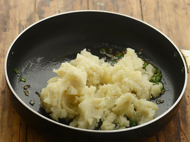 Step 16 – <p>Add potatoes. Boiled carrots, peas, french beans can also be added to make paneer kathi …