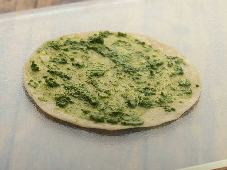 Step 30 – <p>Spread 1 tsp of green chutney evenly over it. Also, you can use schezuan sauce, …