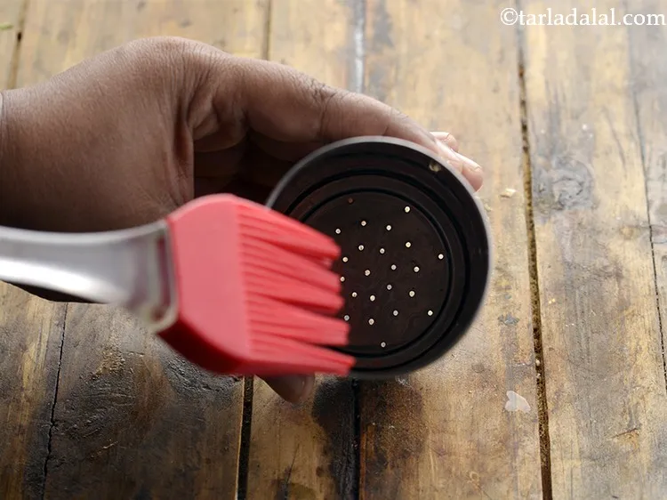 Step 38 – This is a &lsquo;sev press&rsquo;, also called &lsquo;chakli press&rsquo;. Insert the mould with small hole. …