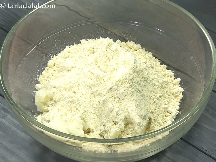 Step 27 – Add 1 3/4 cups&nbsp;<a href="https://www.tarladalal.com/glossary-besan-chana-dal-flour-bengal-gram-flour-952i">besan (bengal gram flour)</a>.