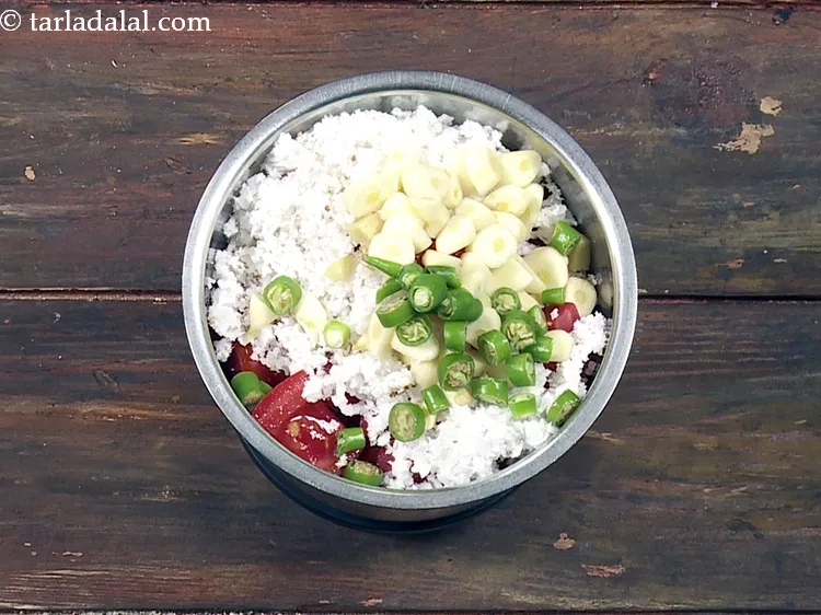 Step 39 – Add 2 tsp&nbsp;roughly&nbsp;<a href="https://www.tarladalal.com/glossary-chopped-green-chilli-820i">chopped green chillies</a>.