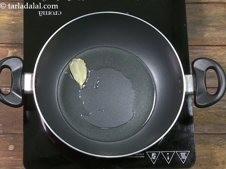 Step 46 – Add 1&nbsp;<a href="https://www.tarladalal.com/glossary-bayleaf-tejpatta-tej-patta-189i">bayleaf (tejpatta)</a>.&nbsp;