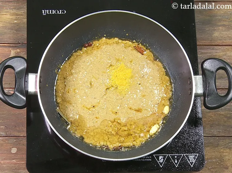 Step 53 – Now add spice powders. First add 1/4 tsp&nbsp;<a href="https://www.tarladalal.com/glossary-turmeric-powder-haldi-645i">turmeric powder (haldi)</a>.