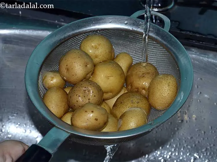 Step 31 – To make the&nbsp;Aloo Chaat&nbsp;, we first have to wash and boil the potatoes. For that, …