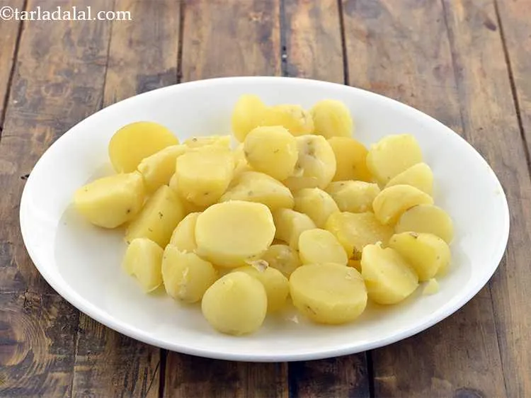 Step 7 – Now peel the potatoes with your hands. Keep aside.