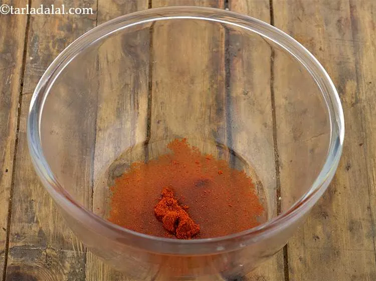 Step 9 – Now add the chilli powder to this for a spicy kick.