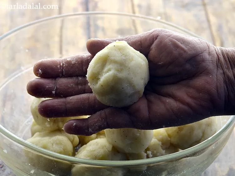 Step 16 – For making the make&nbsp;<strong>Aloo Cheese Croquettes</strong>, take a portion of the potato mixture.