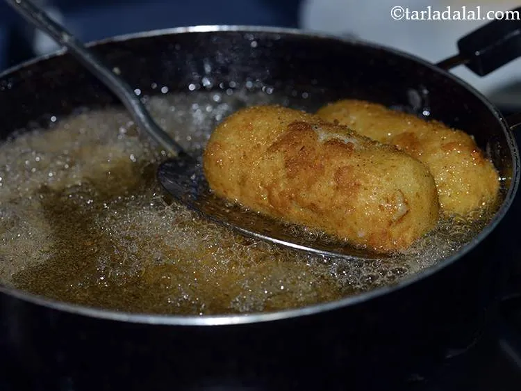 Step 26 – Deep-fry the croquettes on a medium flame till they are golden brown in colour from …
