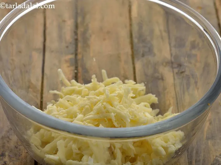 Step 10 – To this, add the grated processed cheese. While the mozzarella cheese provides a stringy effect, …