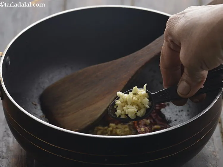 Step 10 – Add the garlic. If you are Jain, then skip adding garlic.&nbsp;