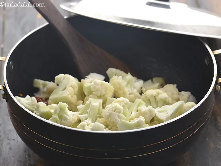 Step 15 – Add the cauliflower. You can even add green peas to give the <strong>aloo gobhi</strong> a …