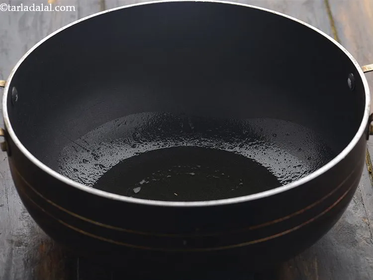 Step 6 – Heat the oil in a deep non-stick kadhai. You can even make use of ghee …