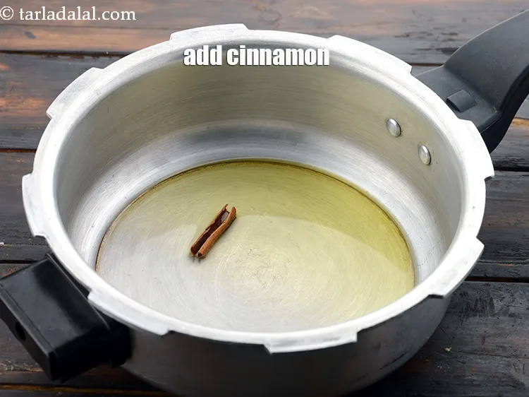 Step 8 – Add&nbsp;25 mm&nbsp;(1&rdquo;)&nbsp;<a href="https://www.tarladalal.com/glossary-cinnamon-dalchini-346i">cinnamon (dalchini)</a>.