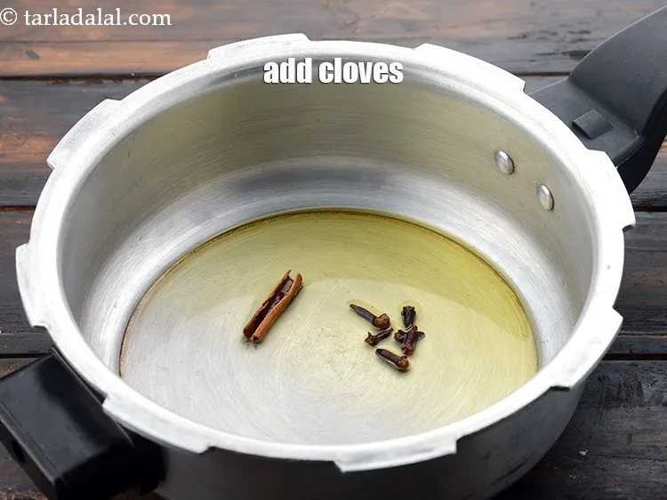 Step 9 – Add 5 to 6&nbsp;<a href="https://www.tarladalal.com/glossary-cloves-laung-lavang-322i">cloves (laung / lavang)</a>.