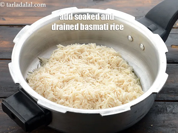 Step 12 – Add the soaked and drained basmati rice. See above how to soak rice.
