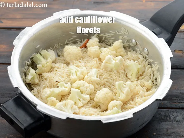 Step 14 – Add 1 cup&nbsp;<a href="https://www.tarladalal.com/glossary-cauliflower-florets-753i">cauliflower florets</a>.
