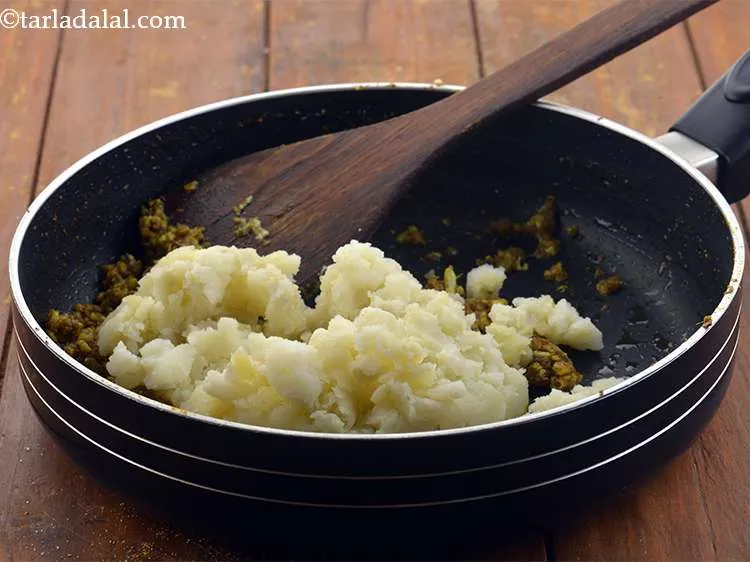 Step 11 – Finally add the potatoes to this mixture. We have used boiled and mashed potatoes but …