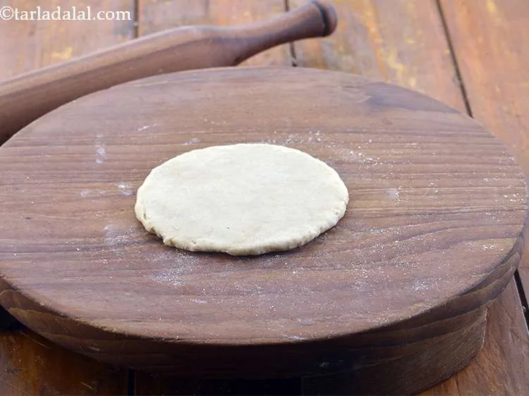 Step 25 – Roll out one portion of the dough into a 100 mm. (4&rdquo;) diameter circle using …