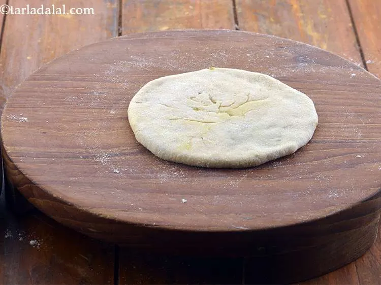 Step 29 – Roll out again into a circle of 150 mm. (5&quot;) diameter using a little plain …