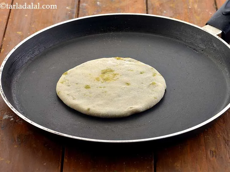 Step 30 – Heat a non-stick pan and place the<strong>&nbsp;Aloo Gobi Paratha</strong>&nbsp;over it.