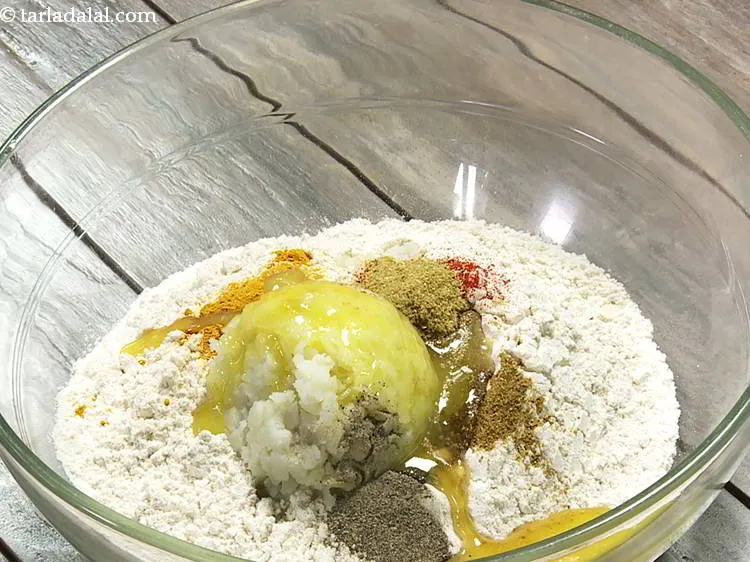 Step 11 – Add melted ghee. This fat basically helps in making soft, flakey pooris.