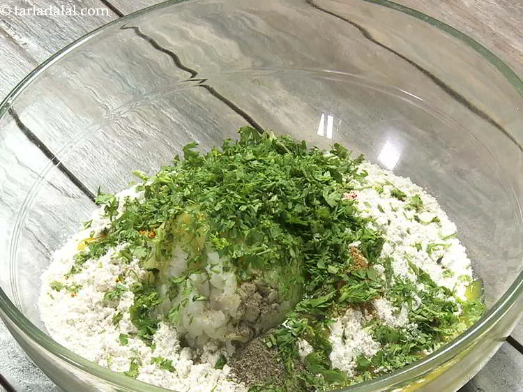 Step 12 – Add finely chopped coriander to give a fresh hint to the aloo masala puri dough.