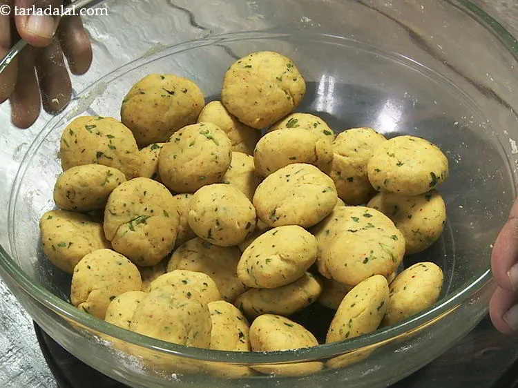 Step 16 – Divide the<strong> potato poori</strong> dough into 35 equal portions. Cover the dough balls to prevent …