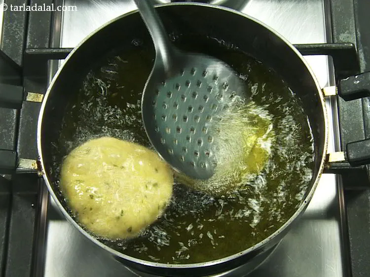 Step 20 – The trick to getting a perfectly fluffy poori is to add a puri in hot …