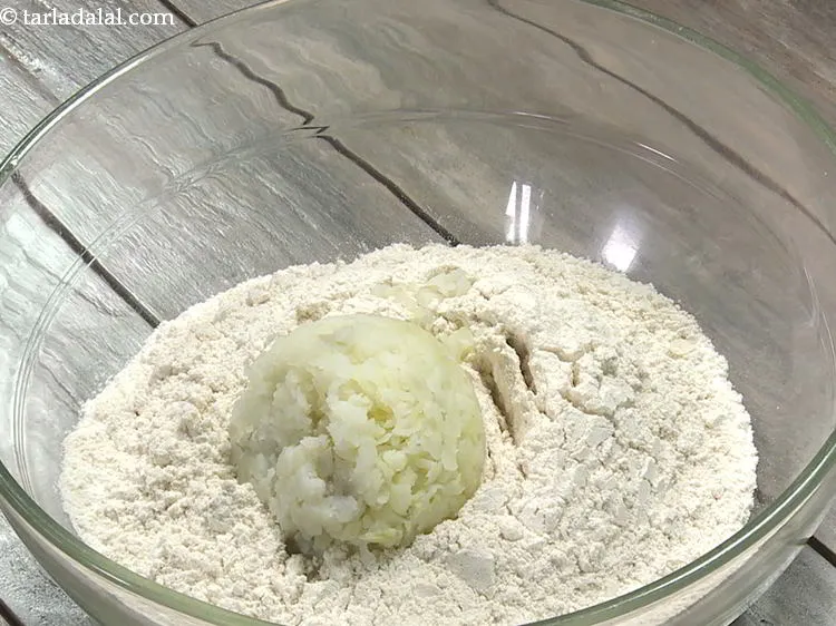 Step 5 – Add grated potato.