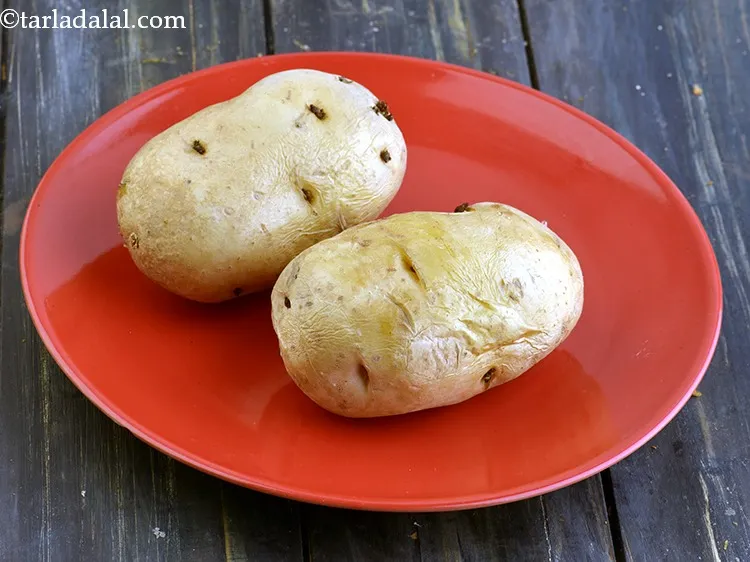 Step 2 – To make the <strong>dry aloo sabzi</strong>, scrub and wash the potatoes. Boil the potatoes in …
