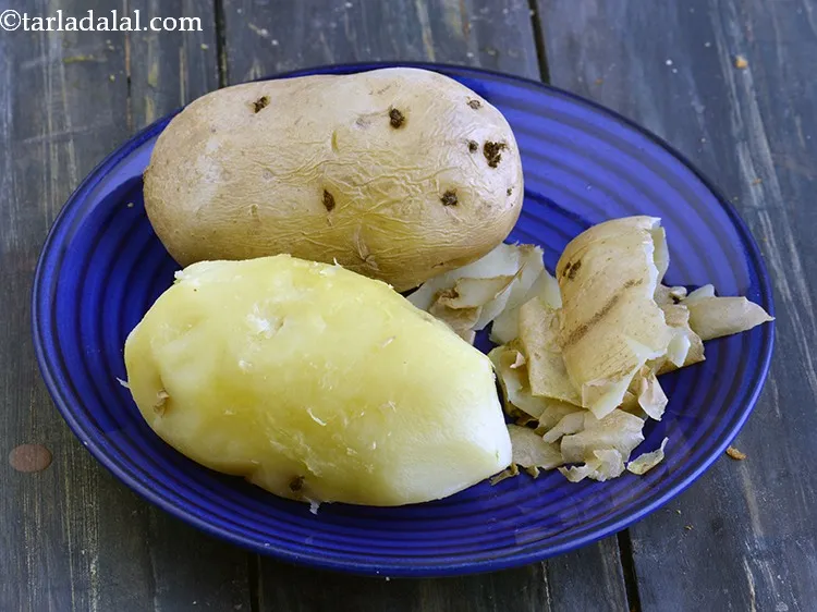 Step 3 – Remove them and keep aside to cool slightly. Peel the skin and discard it.