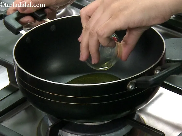 Step 5 – For making the <strong>aloo ki sabzi</strong>, heat the oil in a deep non-stick pan.