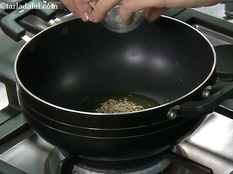 Step 6 – Once the oil is hot, add the cumin seeds.