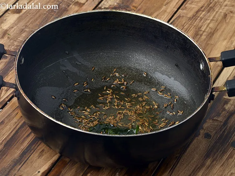 Step 7 – When the seeds crackle, add curry leaves and saut&eacute; on a medium flame for 30 …