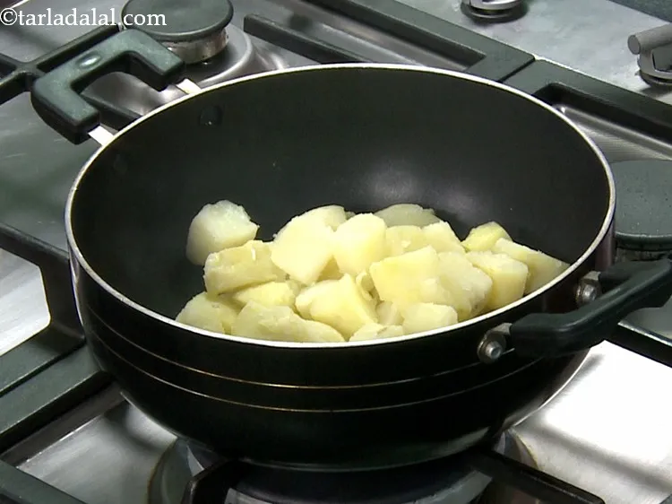 Step 8 – Add all the remaining ingredients, starting with the boiled and peeled potato cubes.
