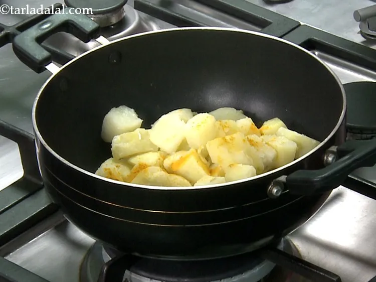Step 9 – Add turmeric powder (haldi).