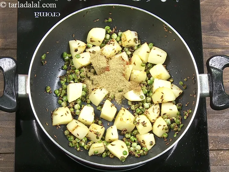 Step 13 – Add 1 1/2 tsp&nbsp;<a href="https://www.tarladalal.com/glossary-coriander-powder-dhania-powder-370i">coriander (dhania) powder</a>.