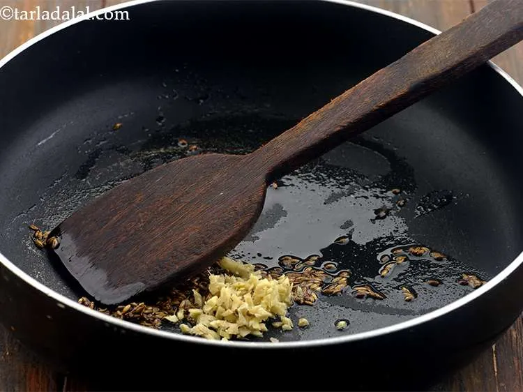 Step 2 – When the seeds crackle, add the ginger. We have finely chopped the ginger but you …