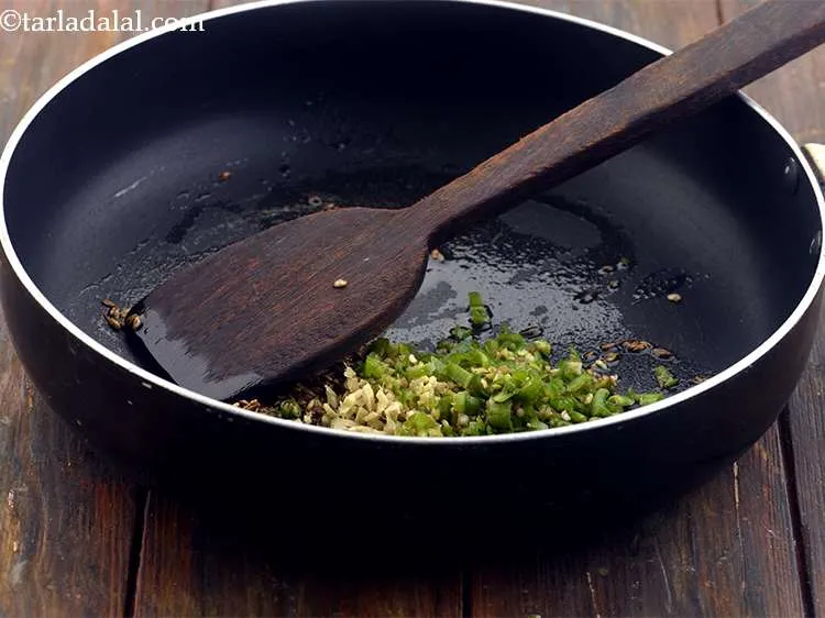 Step 3 – Now add the green chilies for spice.