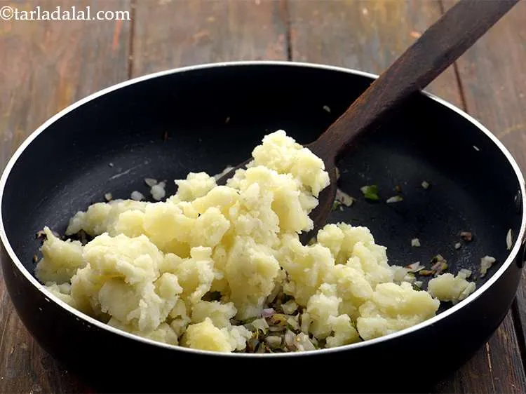 Step 7 – Now add the potatoes to the onions.
