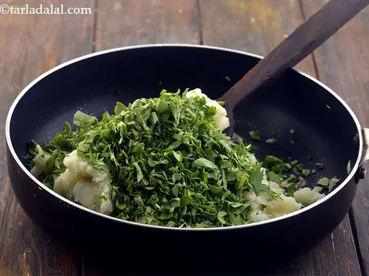 Step 8 – Add the fenugreek leaves. These are washed, dried and finely chopped.